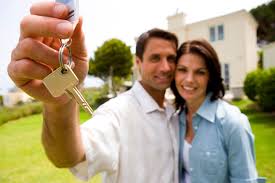 couple with keys to new home